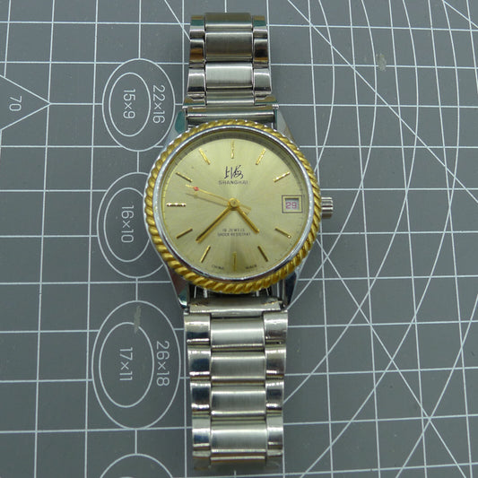 Shanghai Factory 36.5mm manual mechanical watch with 19 jewels, shock-resistant design for durability.