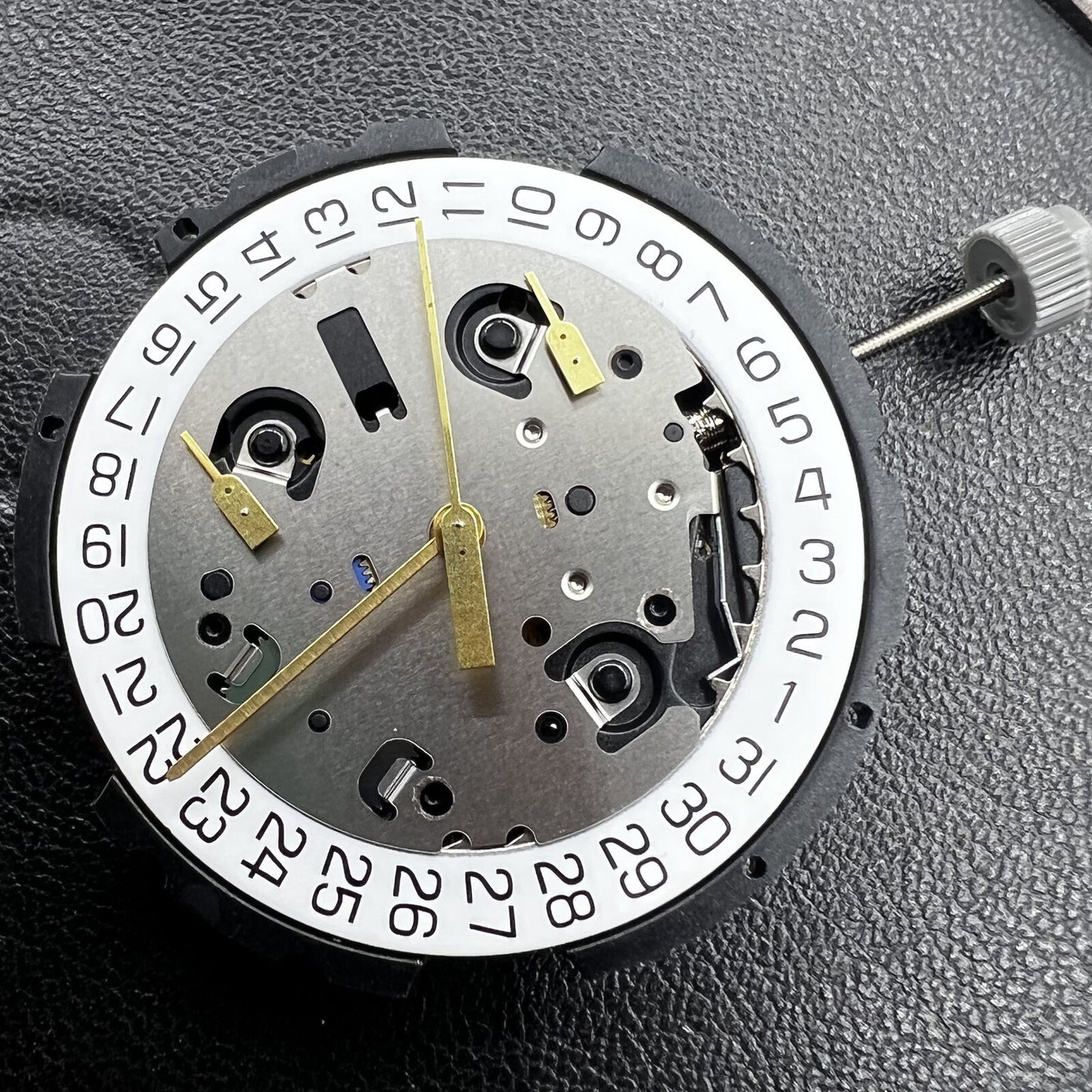 Swiss ETA G10.212 quartz watch movement showing 3 hands and date function for precision timing.