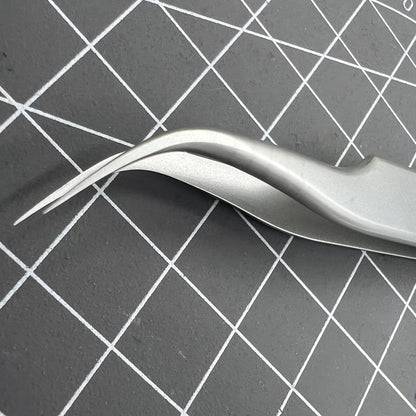 Swiss Bergeon 7026-7 antimagnetic tweezer with fine curved tips for precise watch accessory adjustments.