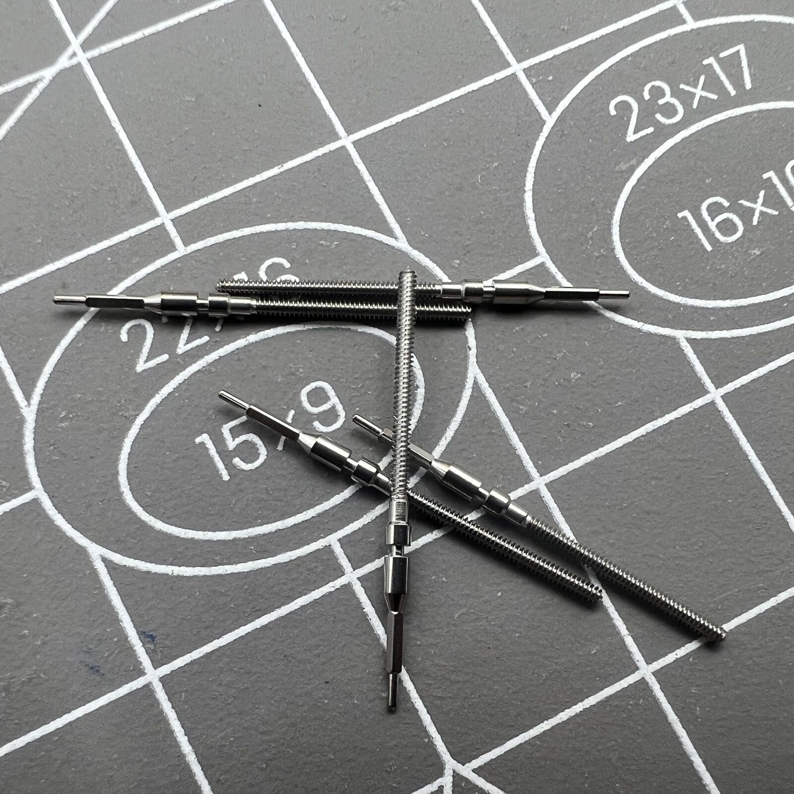Stainless steel winding stem for Citizen 8200 watch movement, durable replacement part.