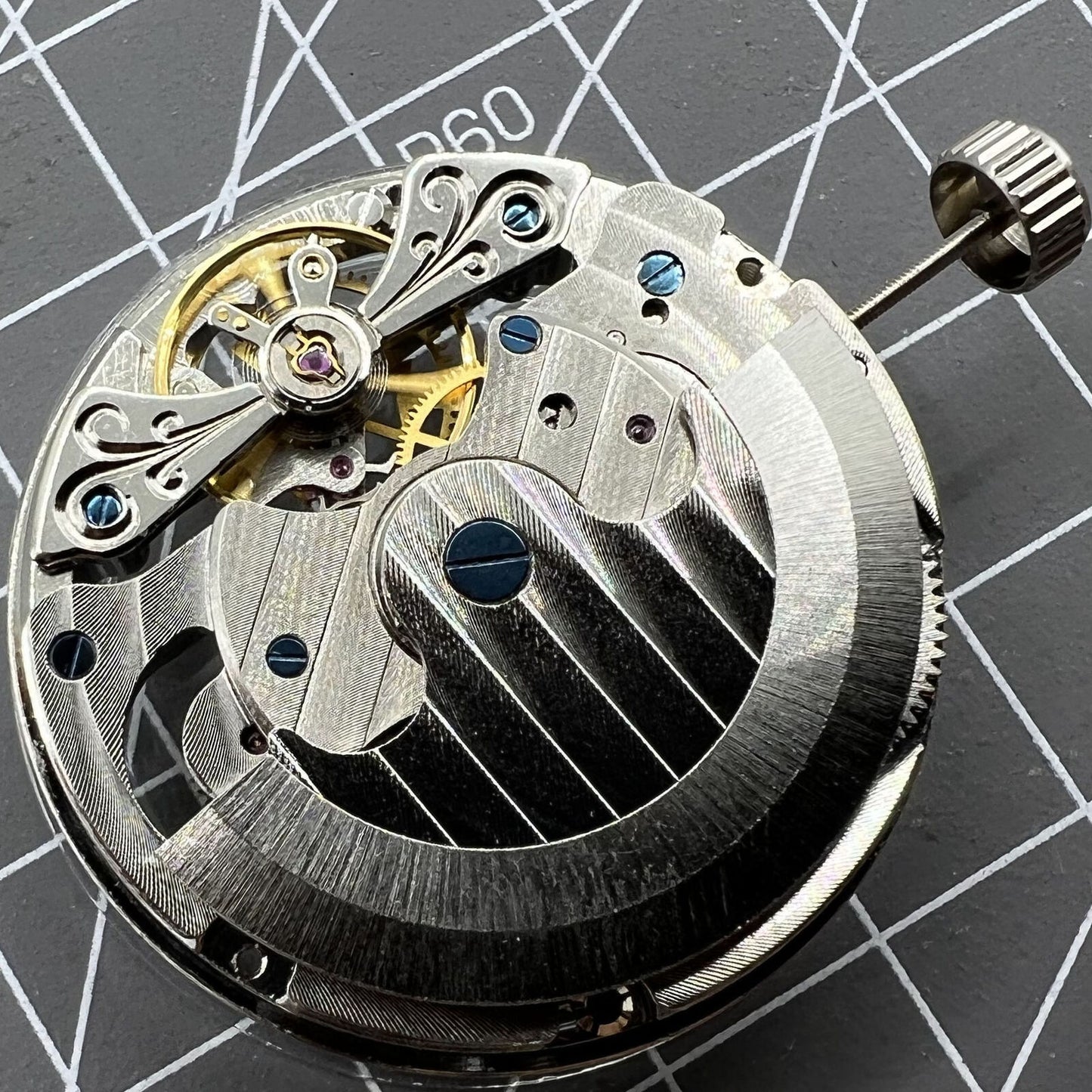 Double Mainspring multi-function hollow mechanical movement watch accessory with dual time zone design.