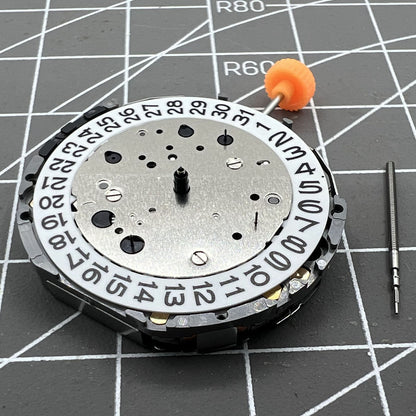 Miyota JS26 quartz watch movement displaying small seconds at 3, 6, 9 and date at 3, Japan-made mechanism.