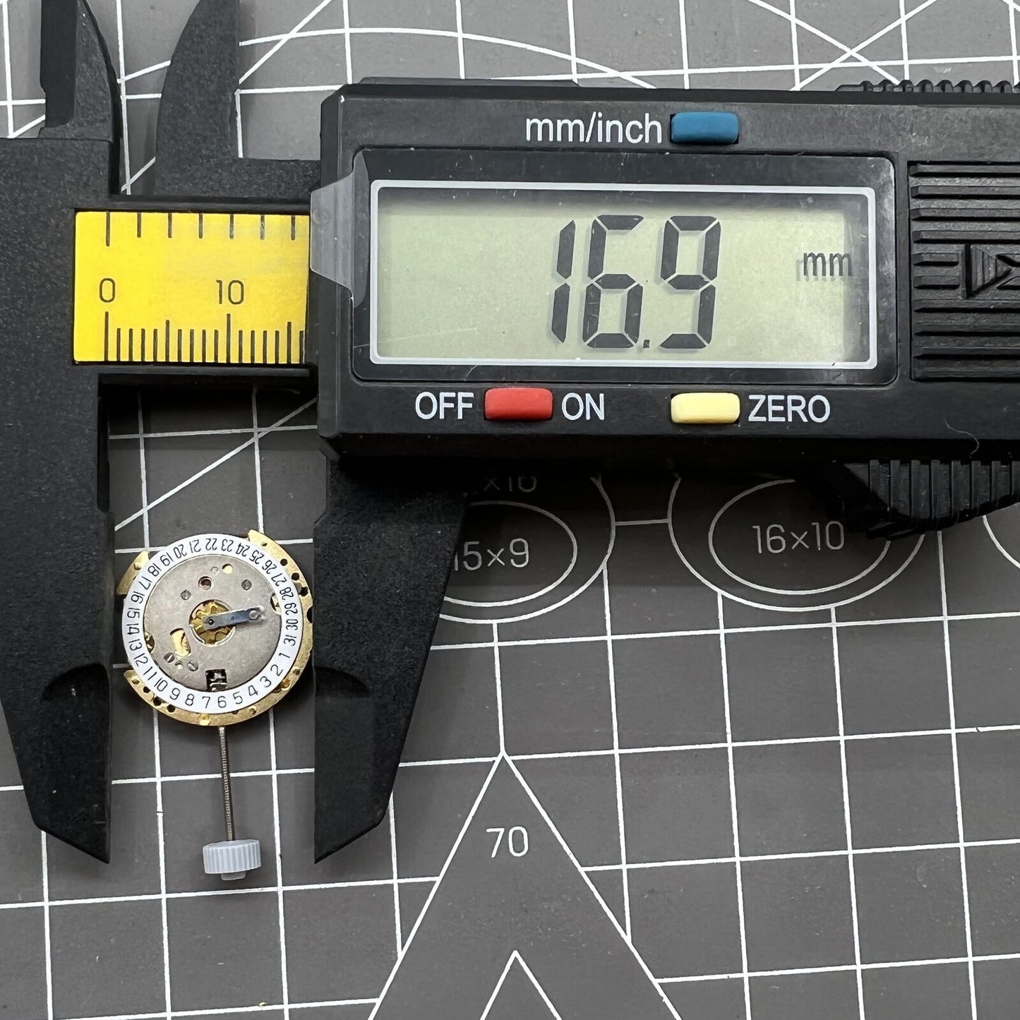 Swiss Made Ronda 775 golden quartz movement with date at 6 for premium Swiss watch brands.