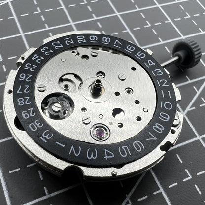 Miyota/Citizen 8215 black dial watch with date at 3, automatic mechanical movement for precision timekeeping.