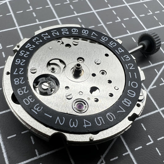 Miyota/Citizen 8215 black dial watch with date at 3, automatic mechanical movement for precision timekeeping.