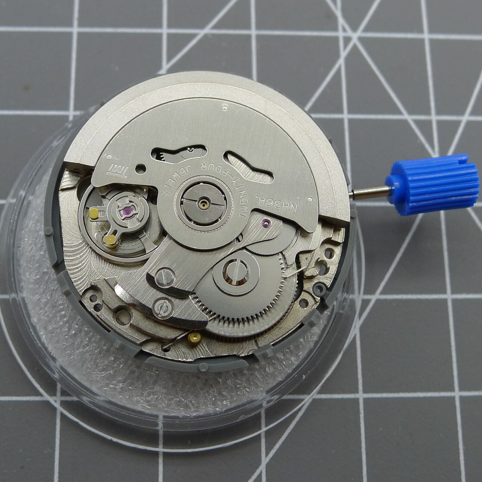 Seiko NH36 automatic watch crown at 3.8 with black dial and gold-tone numerals.