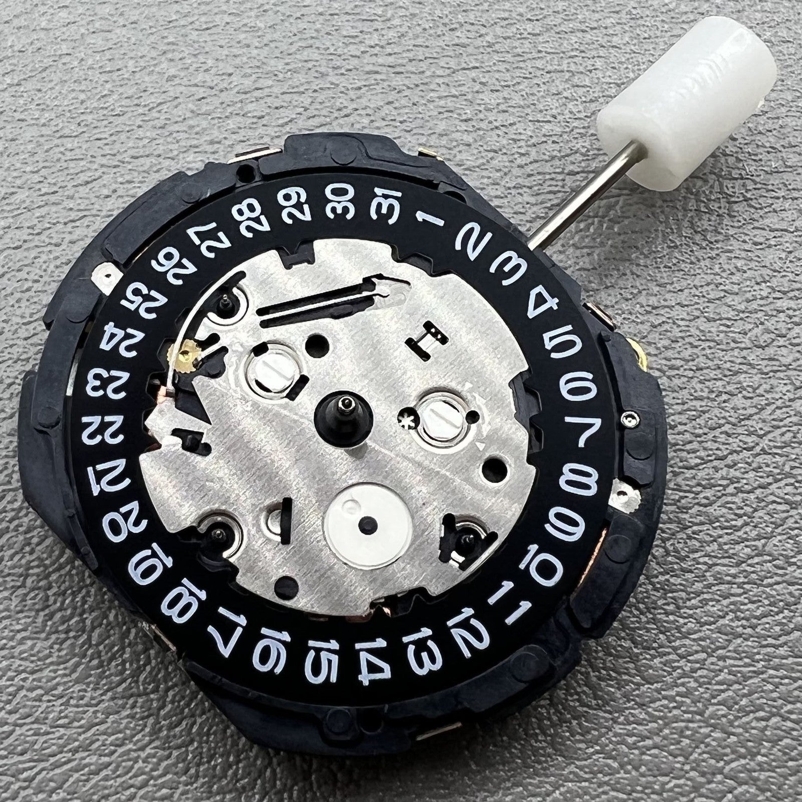 Japan Seiko 7T85A quartz watch movement showcasing precise timekeeping technology.
