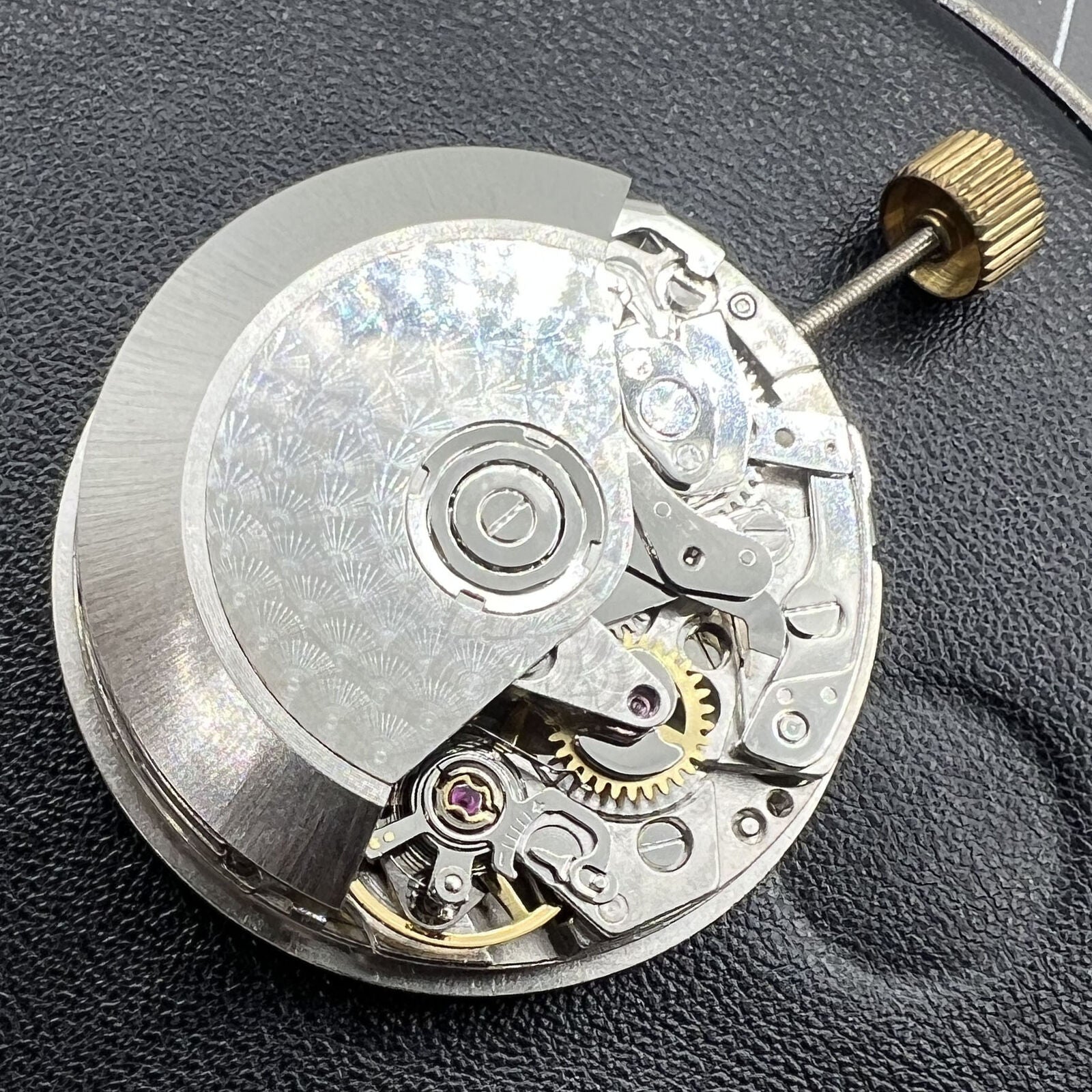 Dandong 7751 automatic watch movement displaying 8 hands for multifunctional time features and precision.