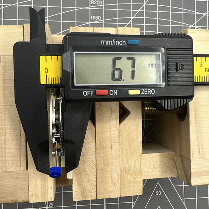 Swiss Ronda 5030D quartz watch movement with date display at 4 o'clock, precision timing by Ronda brand.