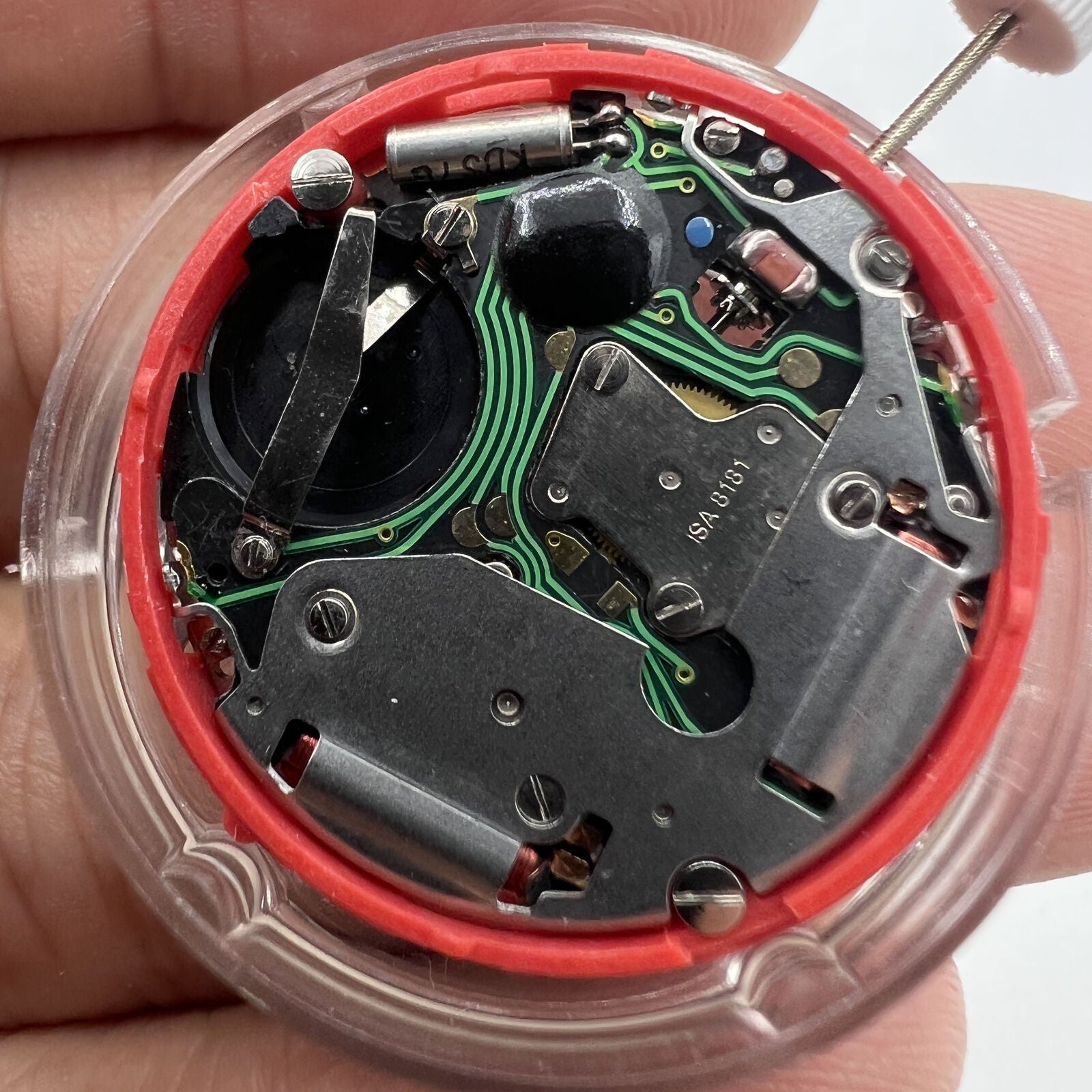 Close-up of ISA 8181 Swiss quartz watch movement featuring single calendar and multifunction for precise timekeeping.