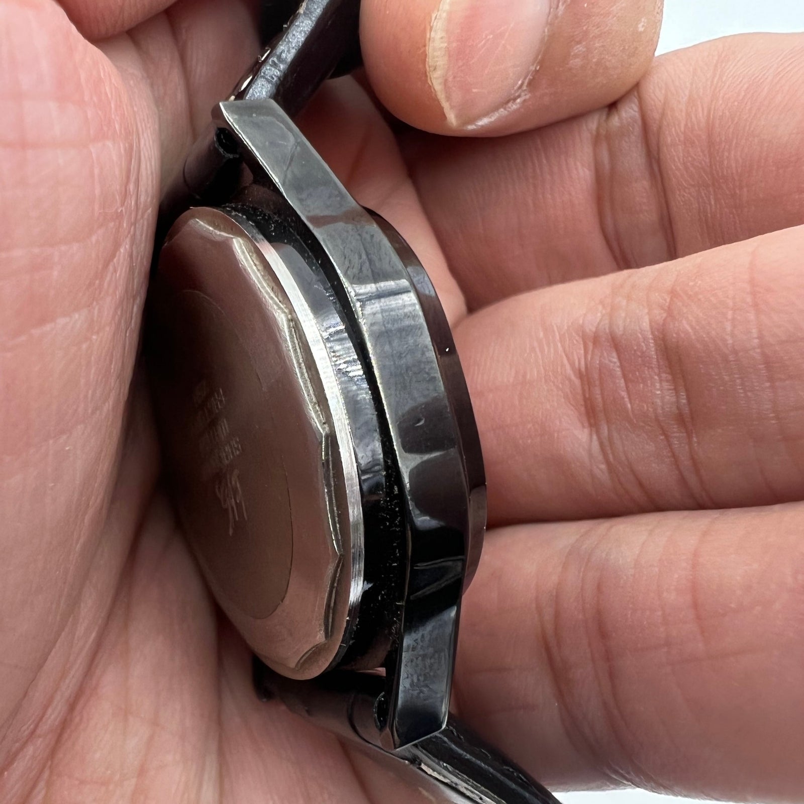 Shanghai Factory 34mm manual mechanical watch with black dial, 19 jewels, shock-resistant for precise timekeeping.