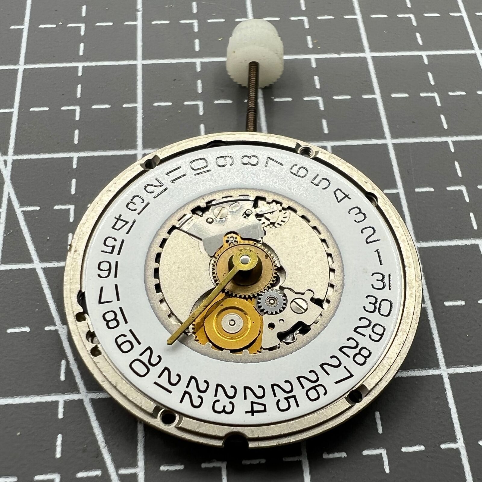 ETA 955.414 Swiss Made quartz watch with silver dial and single calendar display at 3 o'clock.