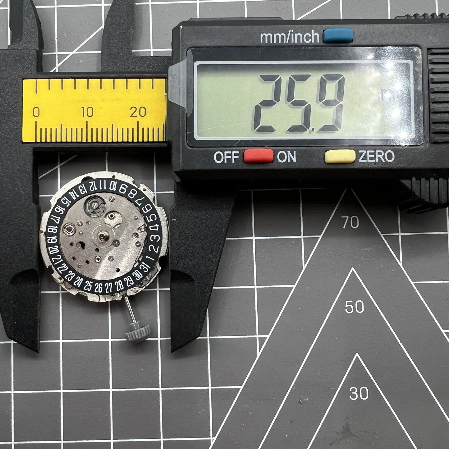 Miyota/Citizen 8215 automatic watch movement with black dial, date at 6, Japan-made precision for smooth timekeeping.