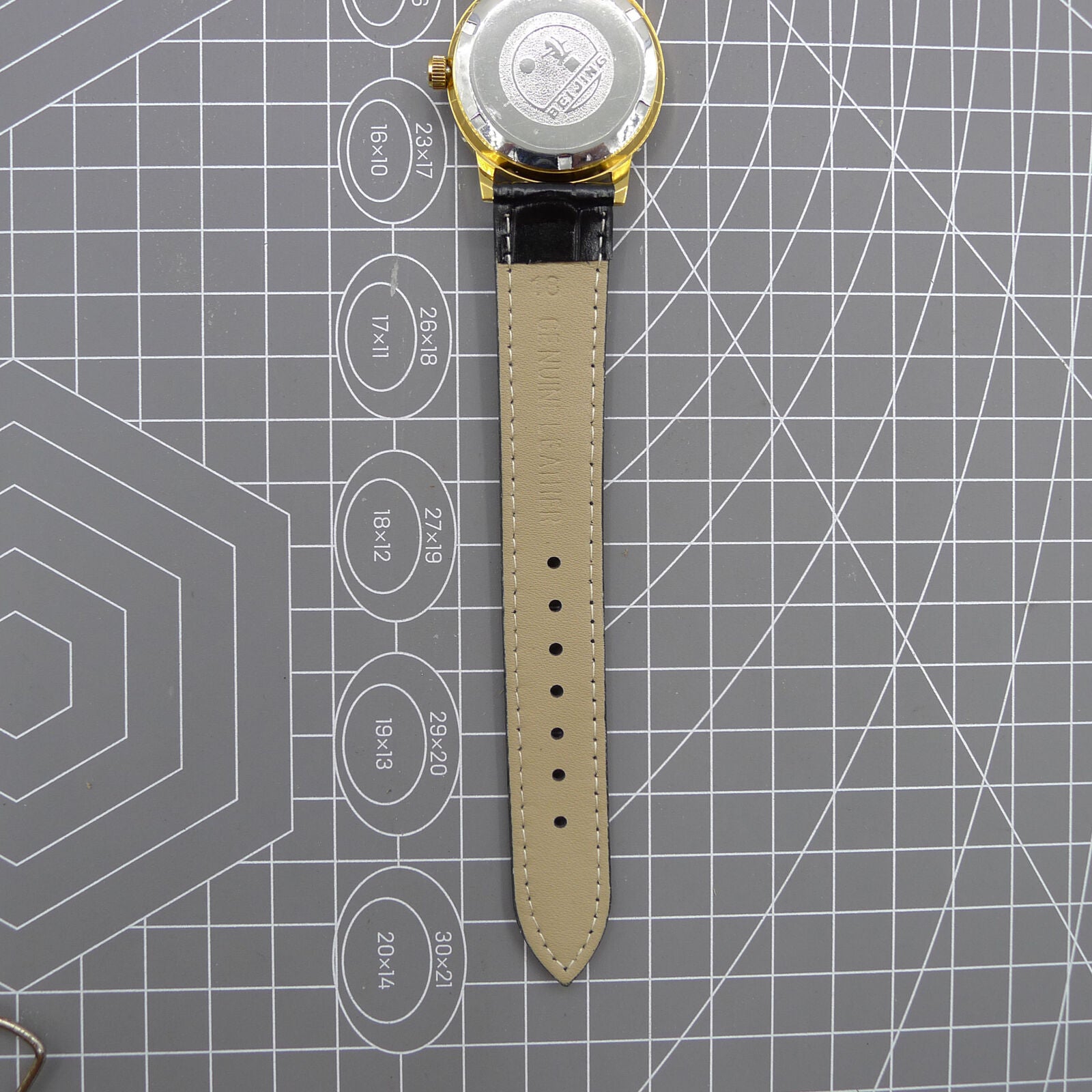 Beijing Double Rhomb watch with golden case, silver nail markers, manual movement for timeless elegance.