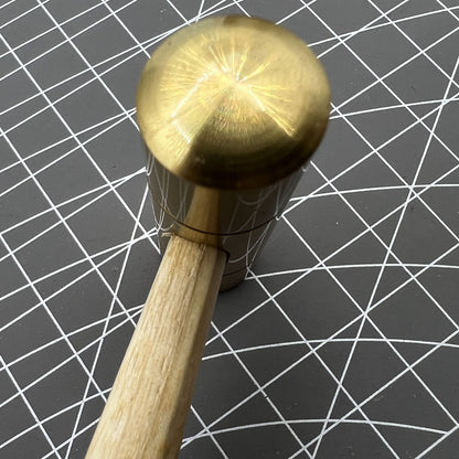 Swiss Made Bergeon 30416 brass hammer for precise watch repairs and accessory adjustments.