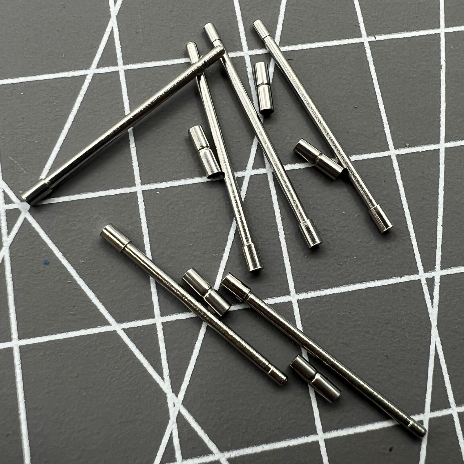 Stainless steel AB-638NTWP notched tubes with pins for secure watch band assembly, 60pcs box.