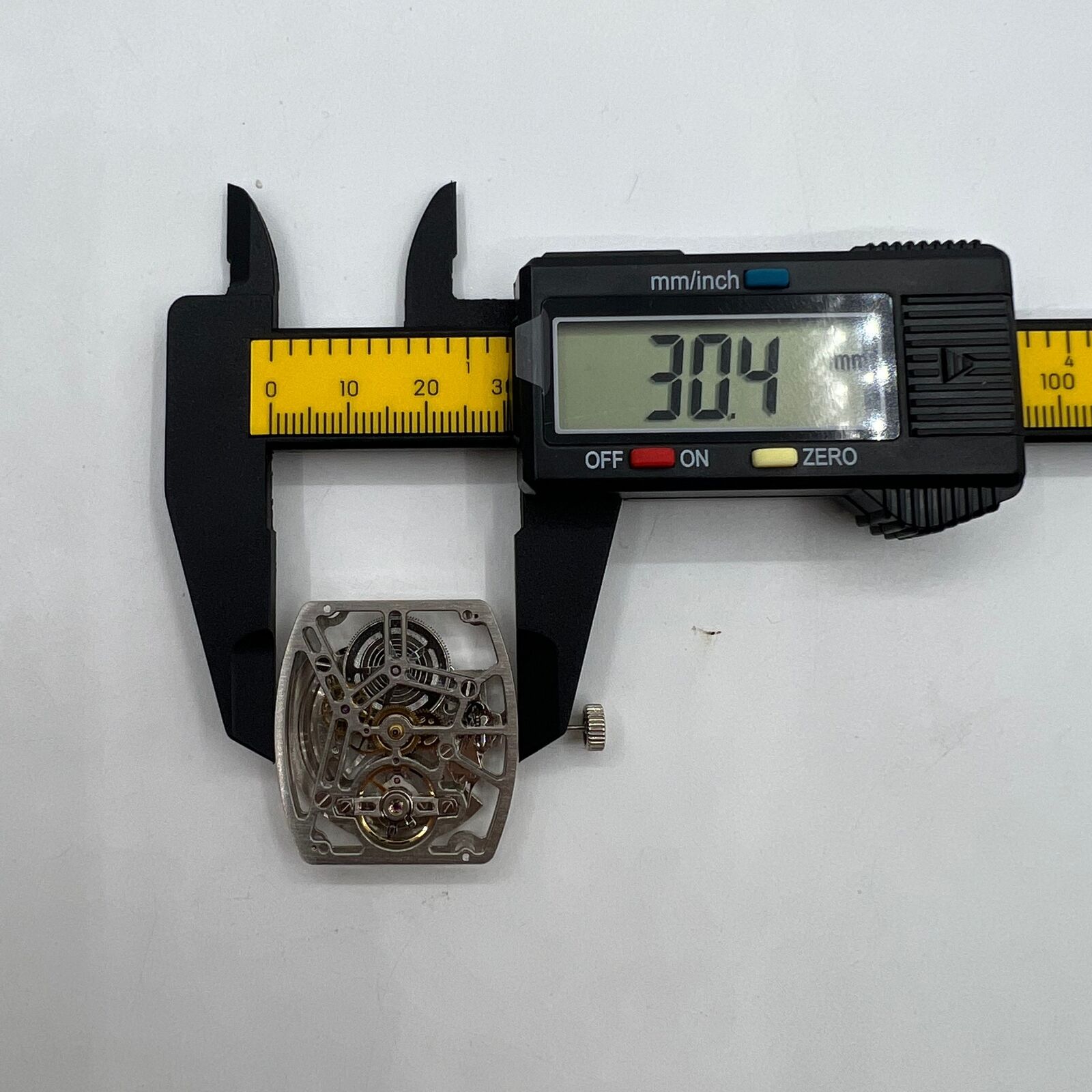 Asian HZ1C01A silver barrel-shaped watch accessory showcasing automatic mechanical movement components.