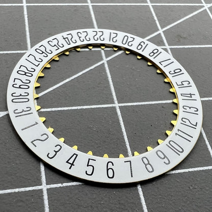 White date disk wheel showcasing original ETA 7750 movement component for precise watch date function.