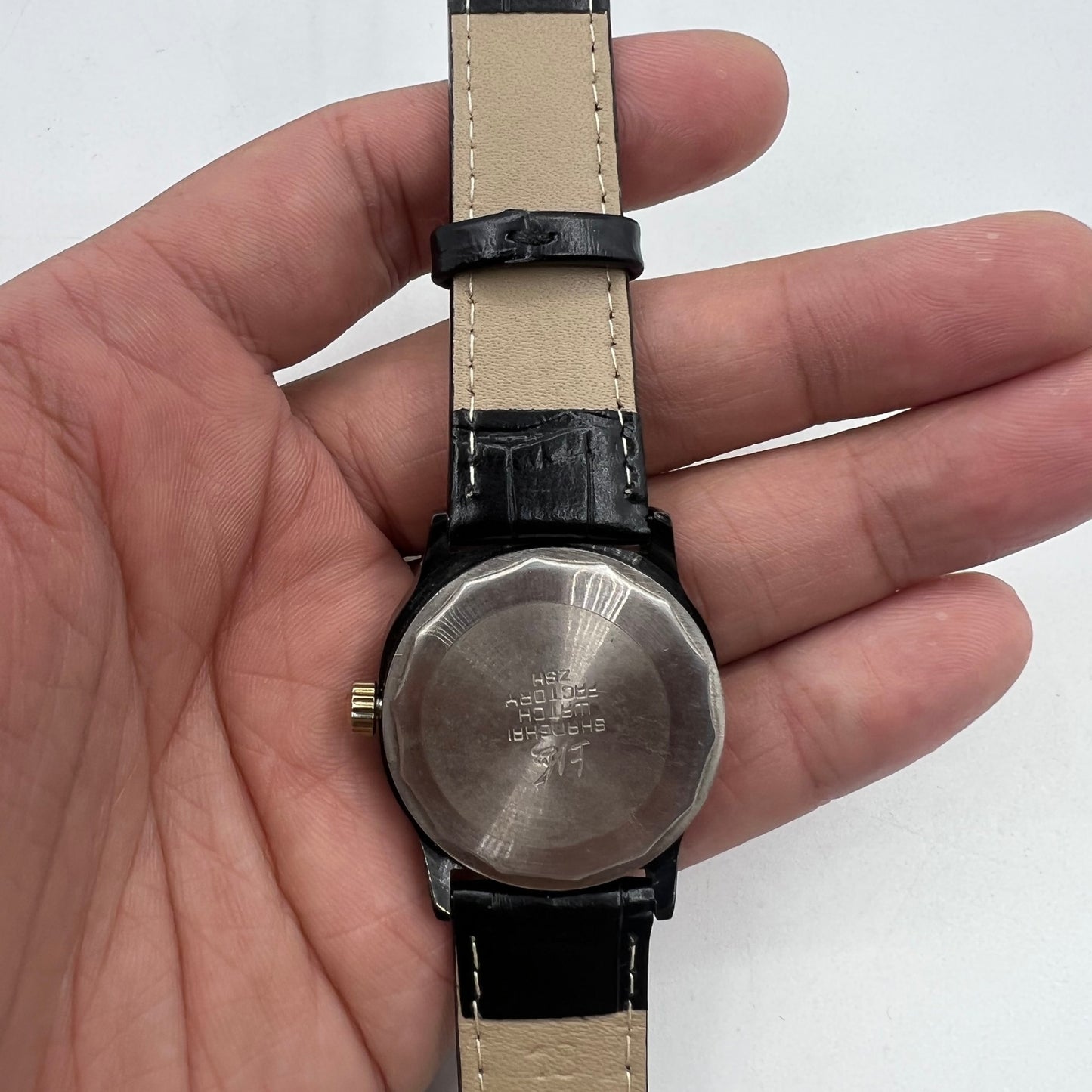 Shanghai Factory 34mm manual mechanical watch with black dial, 19 jewels, shock-resistant, classic design.