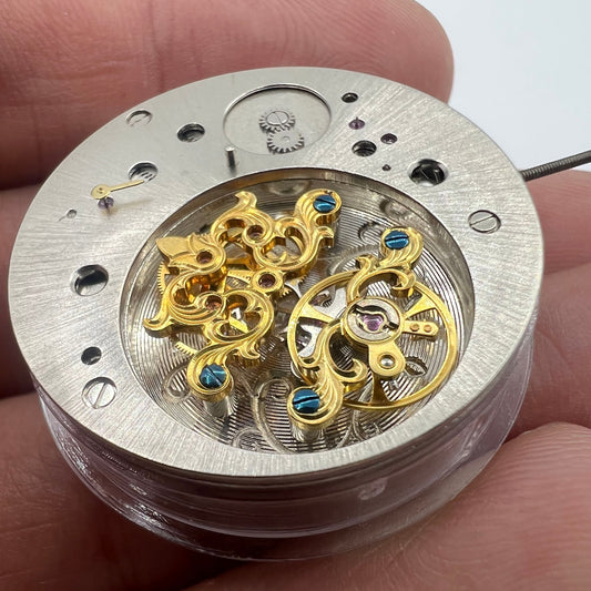 Multifunctional automatic watch with mechanical movement and kinetic energy tourbillon