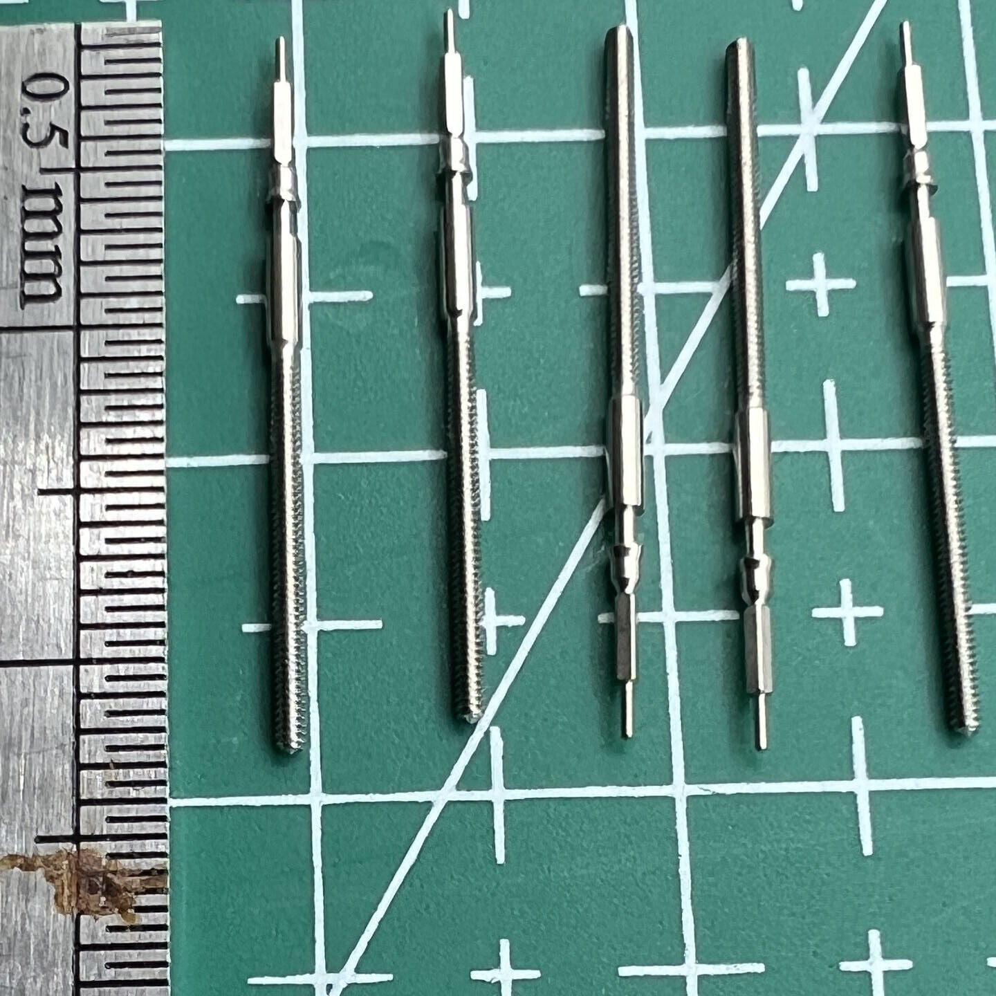 Set of wholesale watch winding stems compatible with Miyota 9015 movement, perfect for repairs.