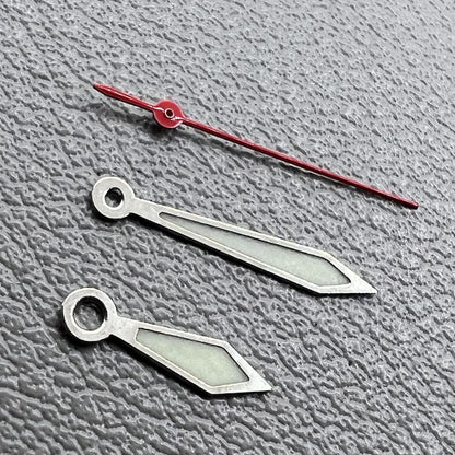 Set of silver-trimmed red second hand and green lume hands for Miyota 1M12 watches.