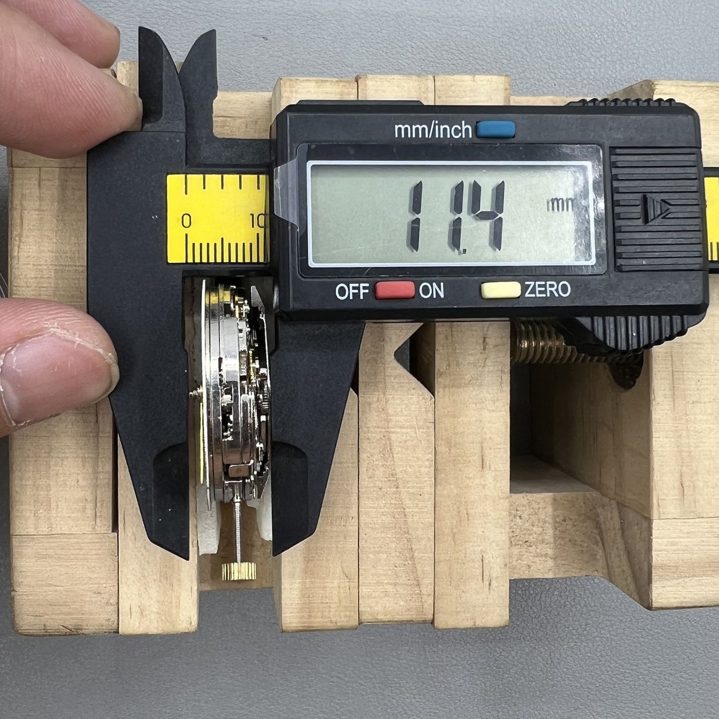 Dandong 7750 mechanical watch movement showing single calendar and small second subdials at 6, 9, and 12 o'clock positions for precise timekeeping