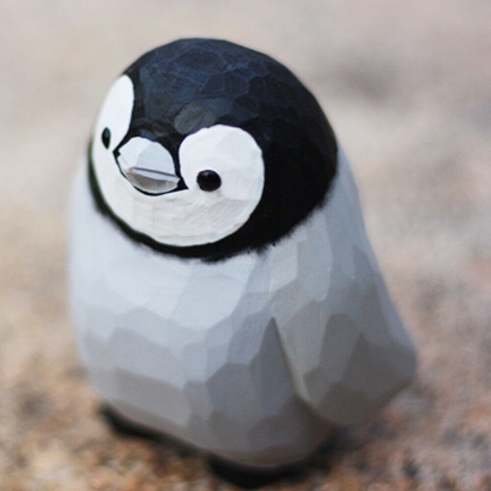 Handmade Little Penguin wooden figurine, detailed collectible sculpture for home decor.