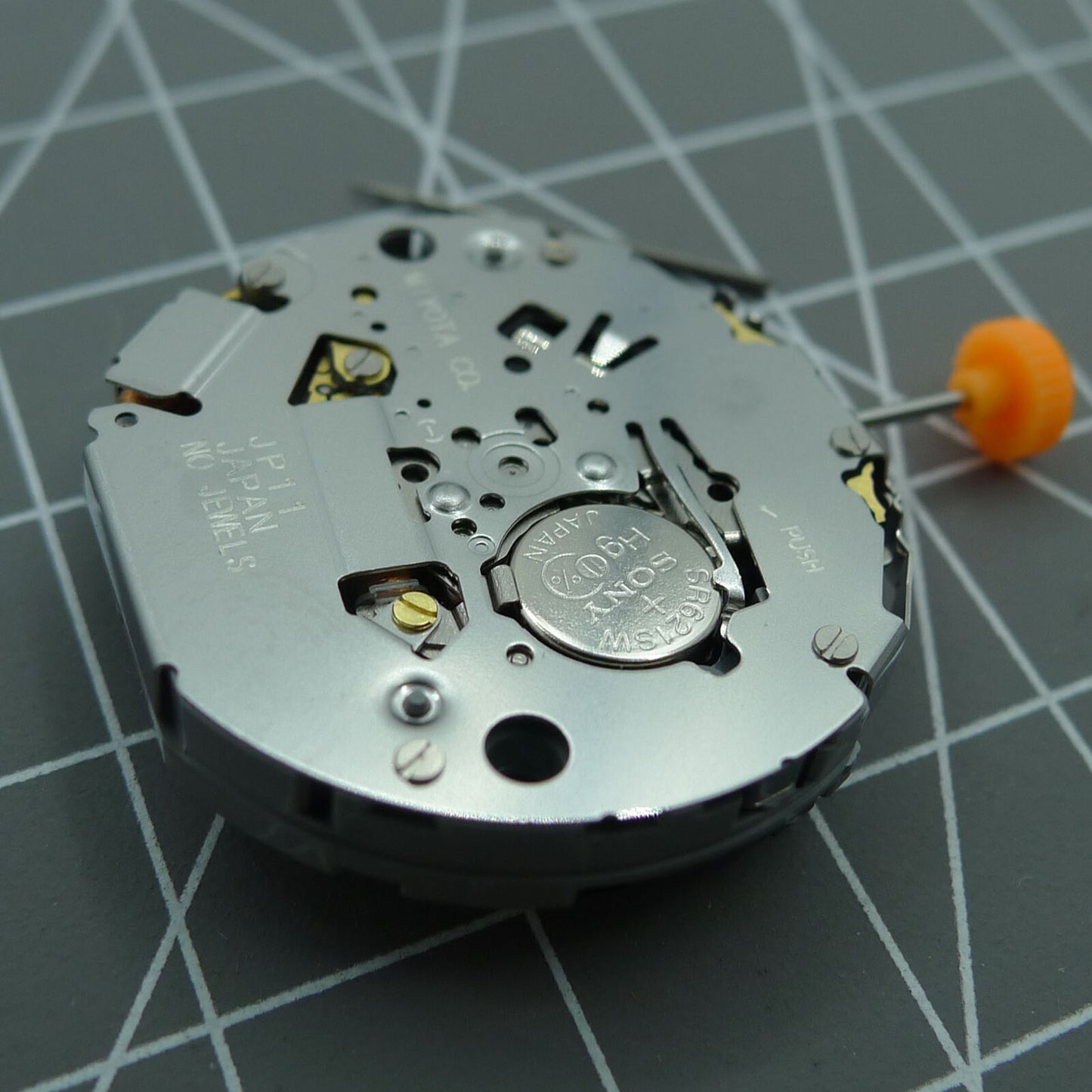 Japan Miyota JP11 quartz watch movement showcasing precise timekeeping with date display at 3 o'clock.