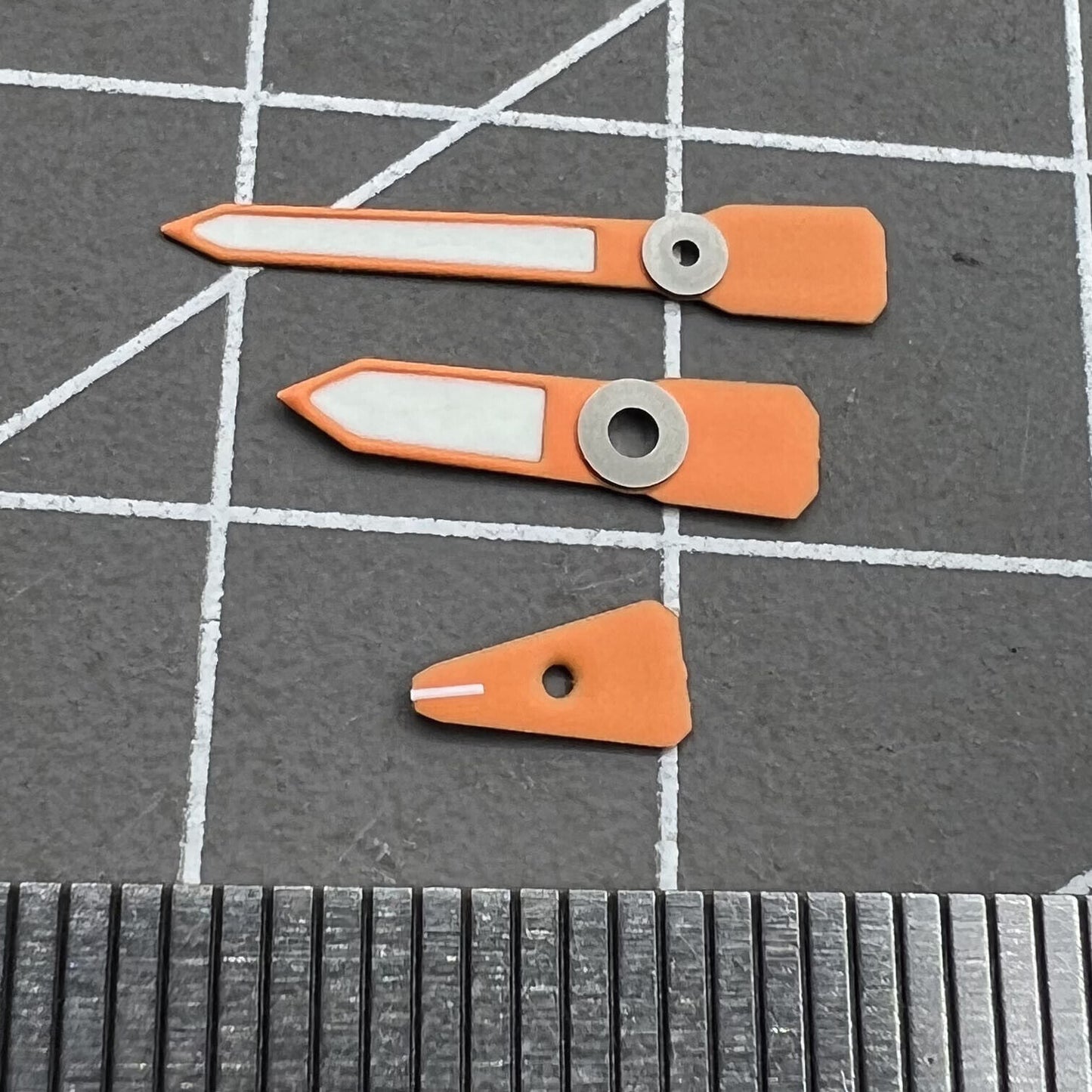 Orange luminous enamel watch hands for Casioak GA2100 GAB2110, enhancing visibility and style.