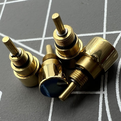 Set of 14 golden stainless steel watch pushers in 7 sizes by Trusted Brand, perfect for classic drive-in watches.