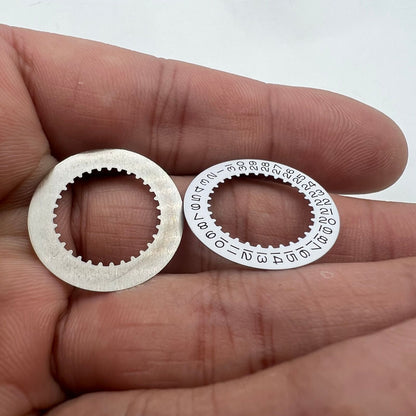 White date disk wheel for RLX 3235 movement, precision replacement part for Rolex watch repair.