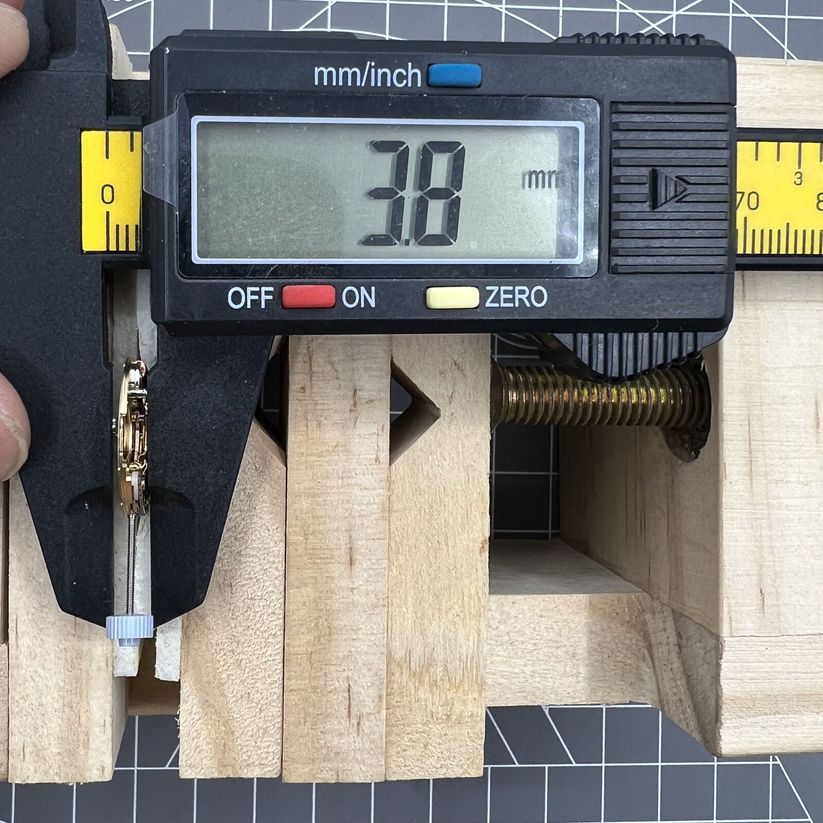 Golden Swiss Made Ronda 775 quartz watch movement with date at 6, ideal for Swiss watch brands.