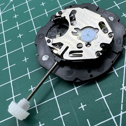 Sunon PE46 quartz watch movement with 2 hands and date display at 3 o'clock for accurate timekeeping.