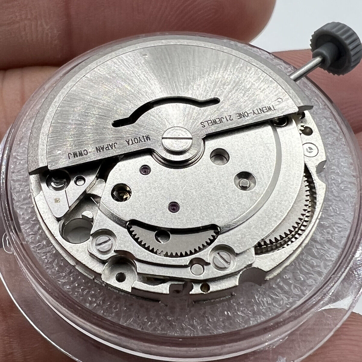 Miyota/Citizen 8215 automatic watch movement, silver plated, date at 6, precision Japanese engineering.
