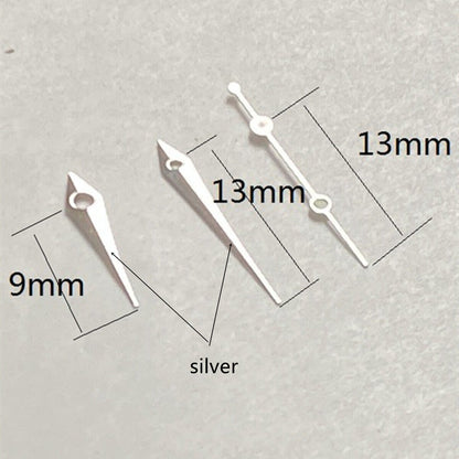 Silver 13mm arrow-shaped watch hands set by Trim, perfect for Ronda 515 quartz movement watches.