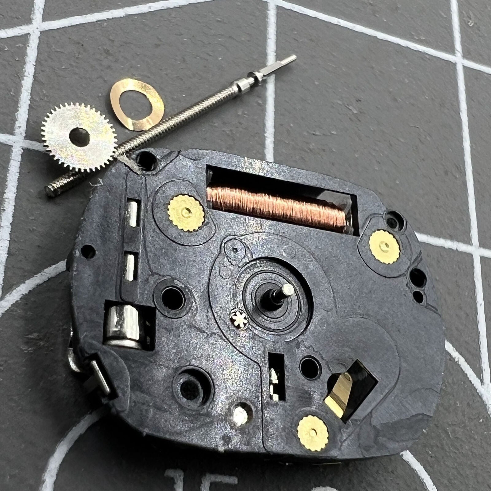 Hattori Epson VX00A quartz watch movement, precision Japan-made timekeeping component for accessories.