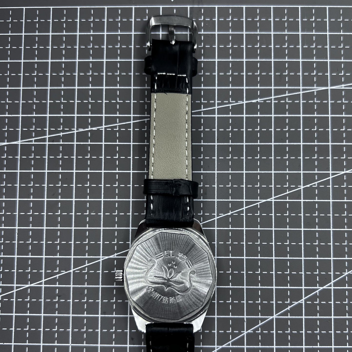 Taihang 32mm manual watch with black strap, gold markers, black dial for classic elegance.