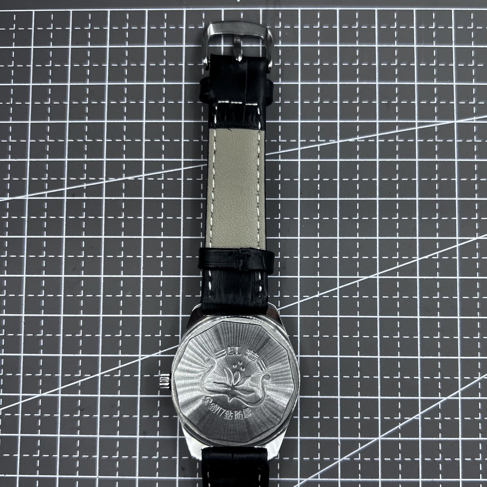 Taihang 32mm manual watch with black strap, gold markers, black dial for classic elegance.