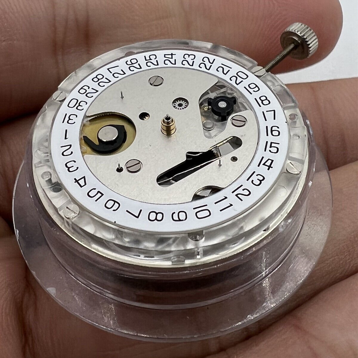 Swiss Made ETA C01.211 chronograph watch movement with white dial by 1853, detailed mechanical design.