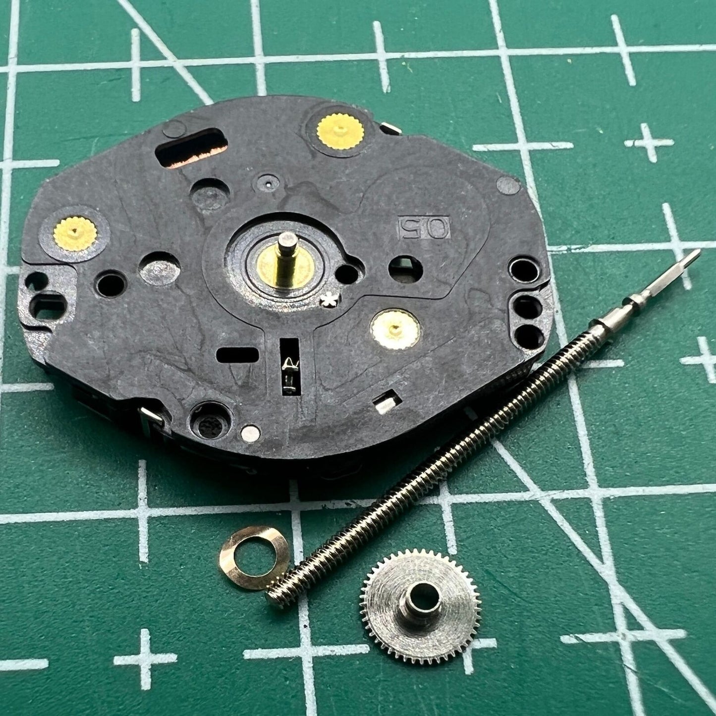 Hattori Epson TMI VX50E quartz watch movement with precision Japan-made mechanism for reliable repairs.