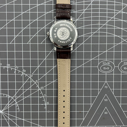 China Baihua 37mm manual mechanical watch with silver dial, 19 jewels, shock-resistant for durable precision timing.