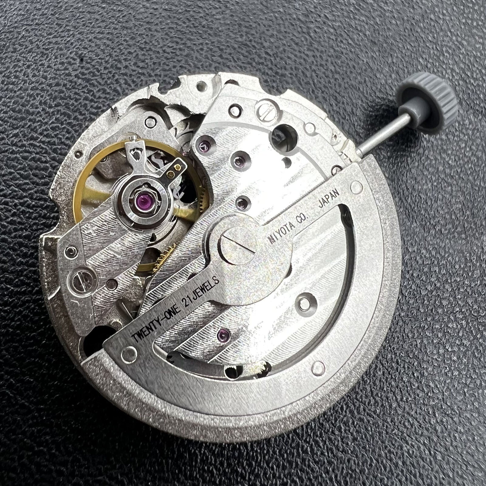 Miyota 8245 silver automatic mechanical watch movement by Citizen, precision-engineered for reliable timekeeping.
