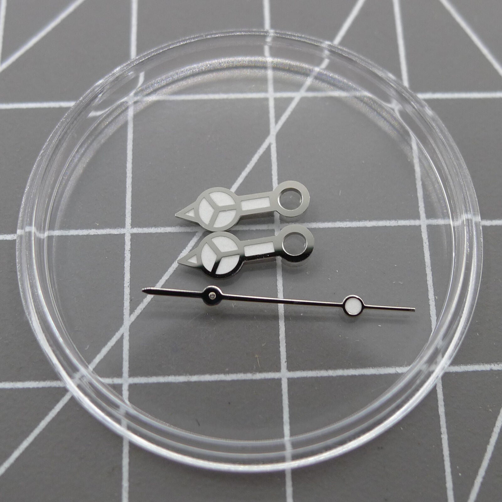 Silver trim green luminous watch hands for NH35A/NH36A movement, enhancing readability and style.