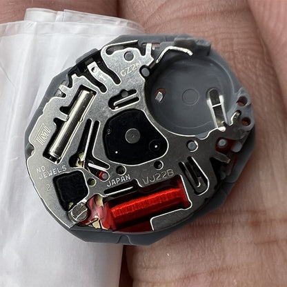 Hattori Epson VJ22 quartz watch movement with date at 3 and 6, Japanese precision craftsmanship