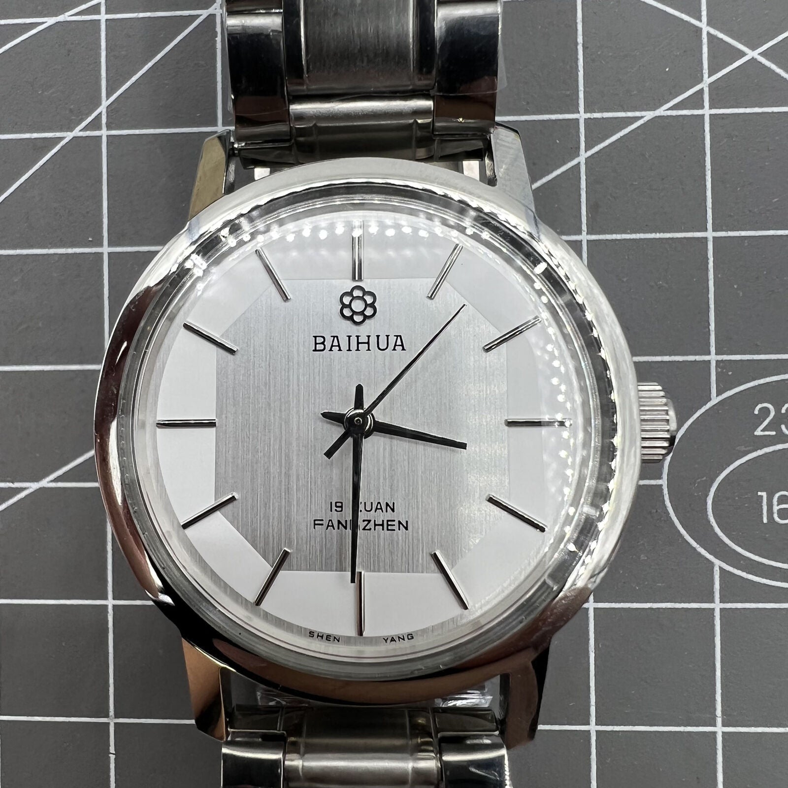 37mm China Baihua manual mechanical watch with silver dial, 19 jewels, shock-resistant for lasting precision.