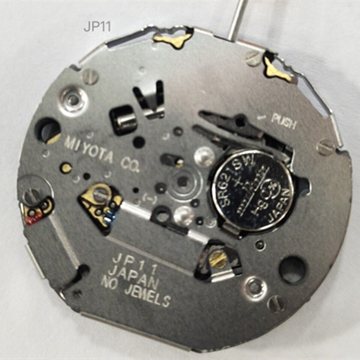 Miyota JP11 quartz watch movement with date display at 3 o'clock, precise timekeeping.