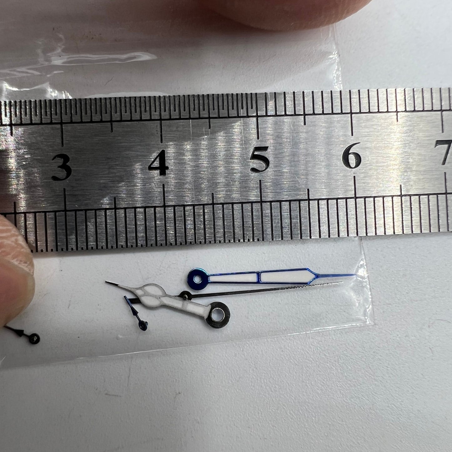 Blue-trimmed green lume watch hands for Miyota OS10 0S10, enhancing nighttime readability.