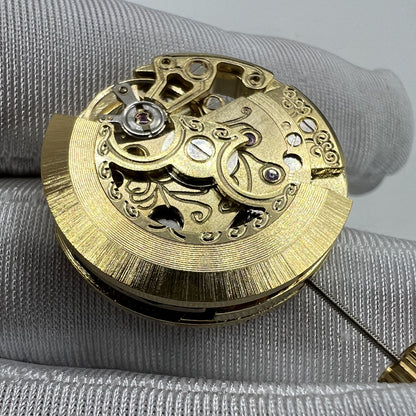Golden 26.5mm 7120 automatic watch movement with carved hollow design, ideal for watch repairs.