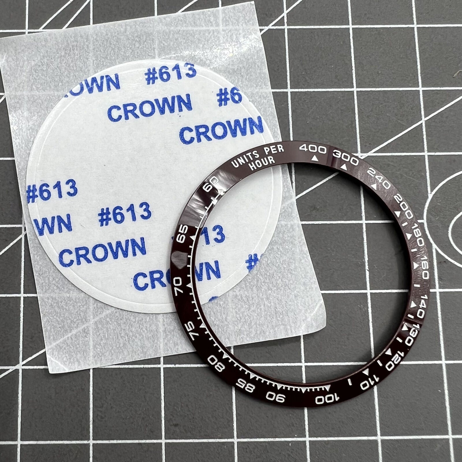 Ceramic watch bezel for Daytona, 37.65x30.7mm, brown slope with white font, durable accessory.